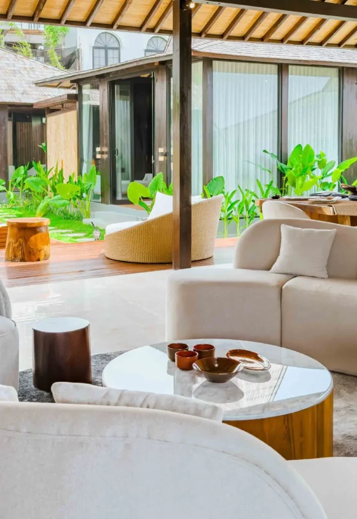 Living room opening onto the outdoor area in a contemporary Joglo-style villa in Bali