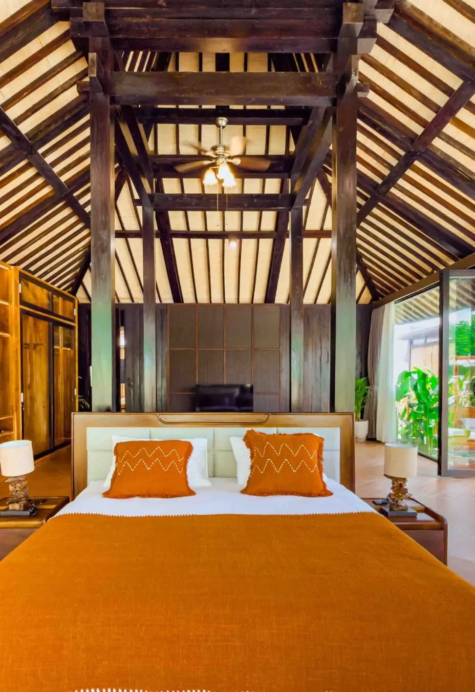 Master bedroom bed in a contemporary Joglo-style villa in Bali