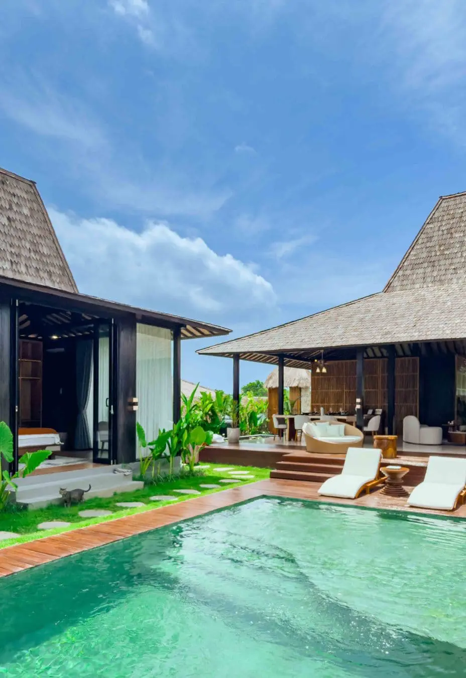 Pavilion and second bedroom overlooking the pool within a contemporary Joglo-style villa in Bali