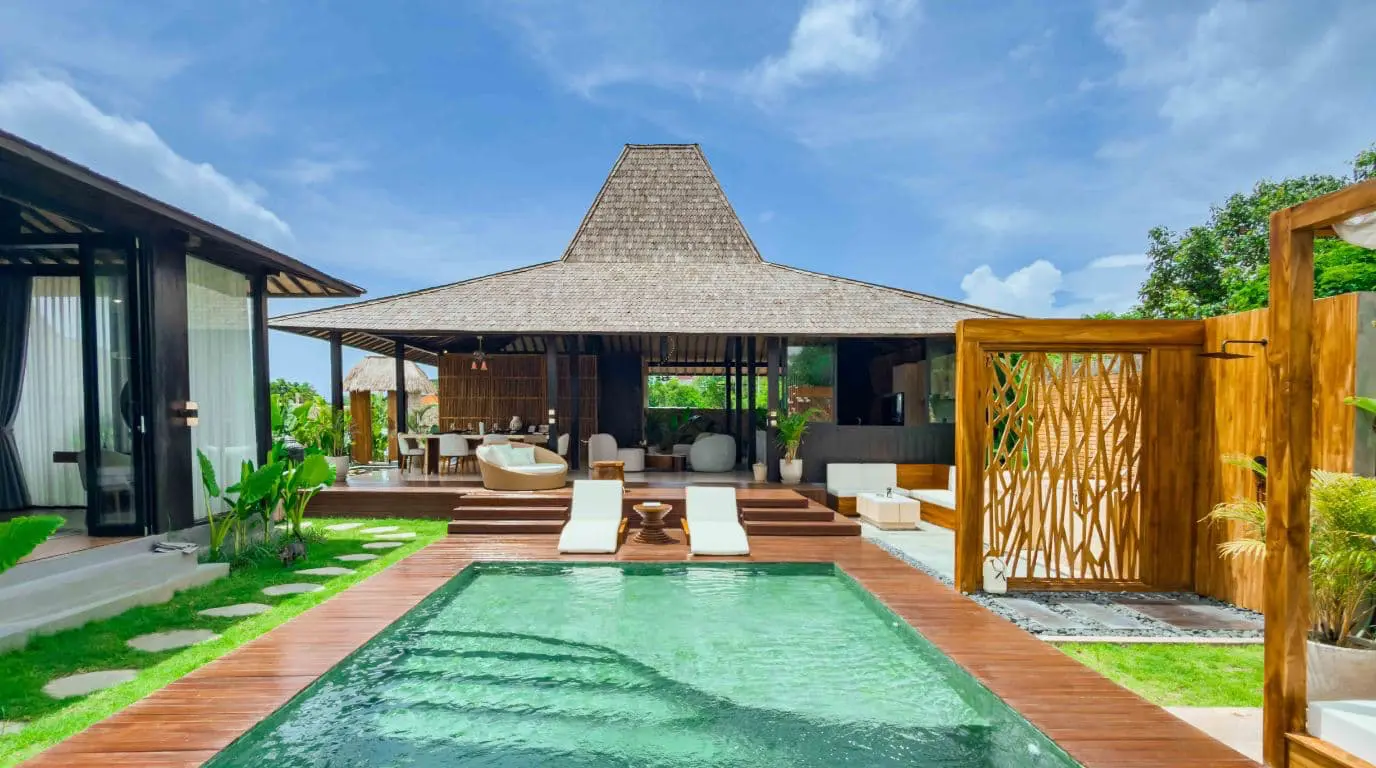 The bathroom features a refined vanity with handcrafted stone sinks, a large mirror and carefully selected amenities, reflecting the villa’s attention to detail and comfort.